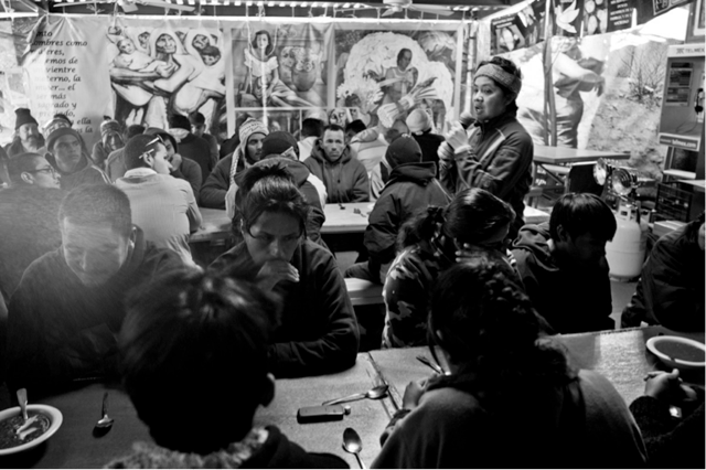 Migrants prepare to eat in the comedor (Nogales, Sonora, Mexico); photo used with permission of the Kino Border Initiative.